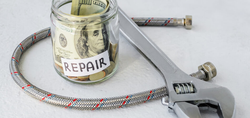 Repair,word,,coins,and,dollar,bill,in,glass,jar,near